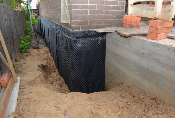 Happy homeowners after waterproofing job in West Sayville